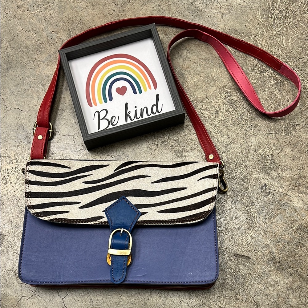 * Vibrant Red and Blue Cosmetic Bag with Rainbow Design
